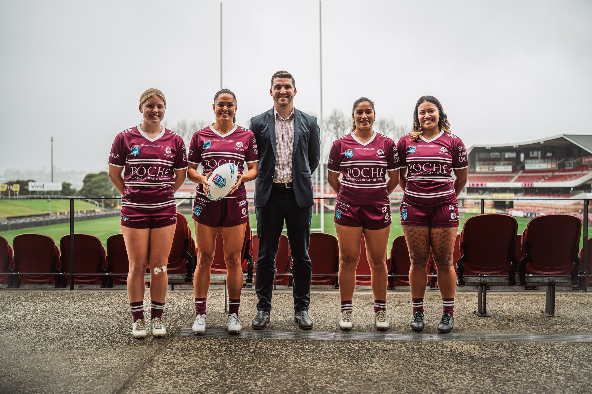 Scott Bear with players from the Sea Eagles’ new Harvey Norman NSW Women's Premiership team-jpg