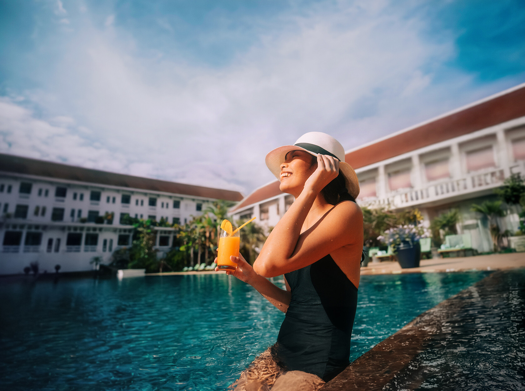 Cambodia-Siem Reap-Raffles Grand Hotel-Pool-Woman-Drink-2023-51_EXT_2_RGB_V2-jpg